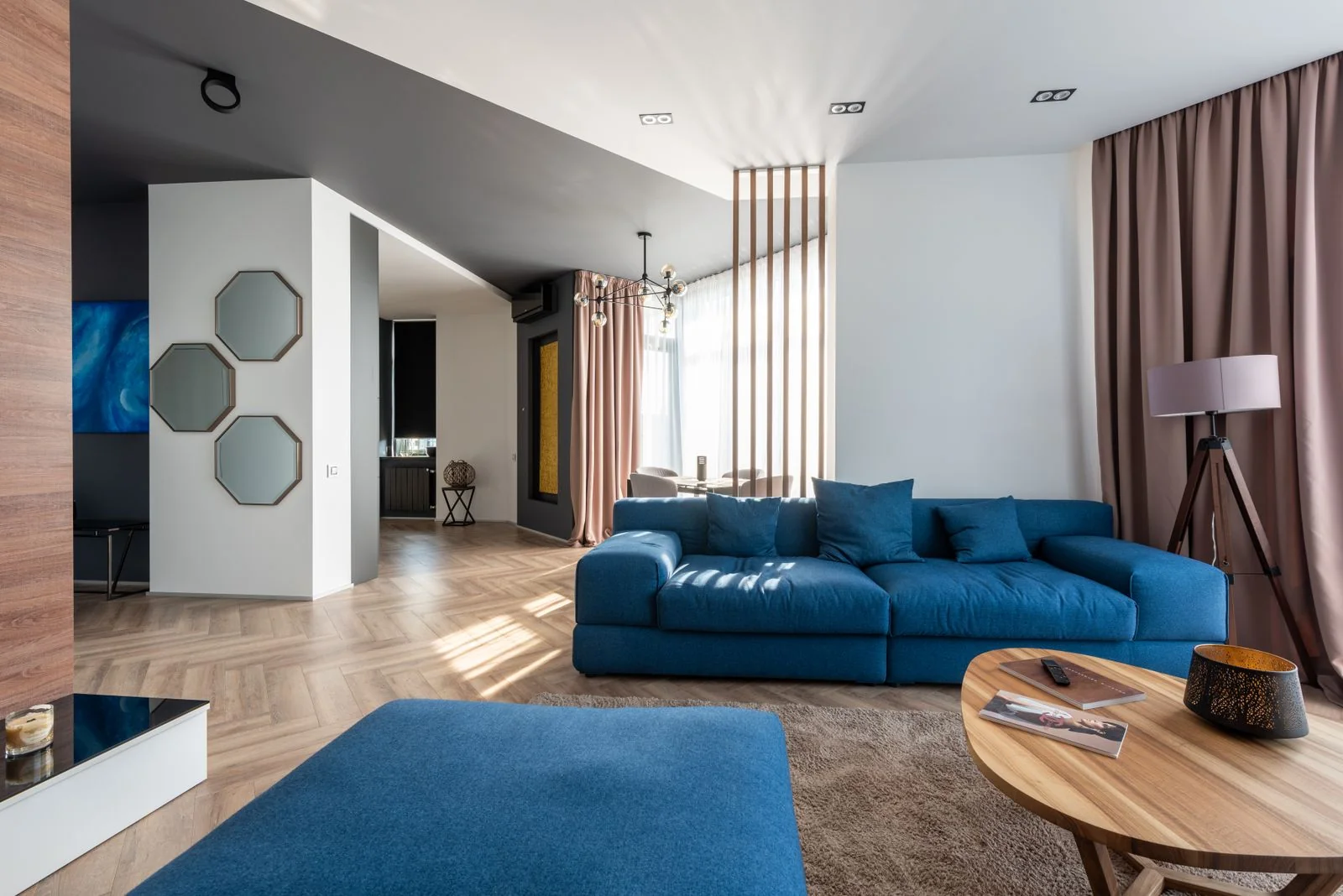 Real apartment interior with blue seating and warm parquet
