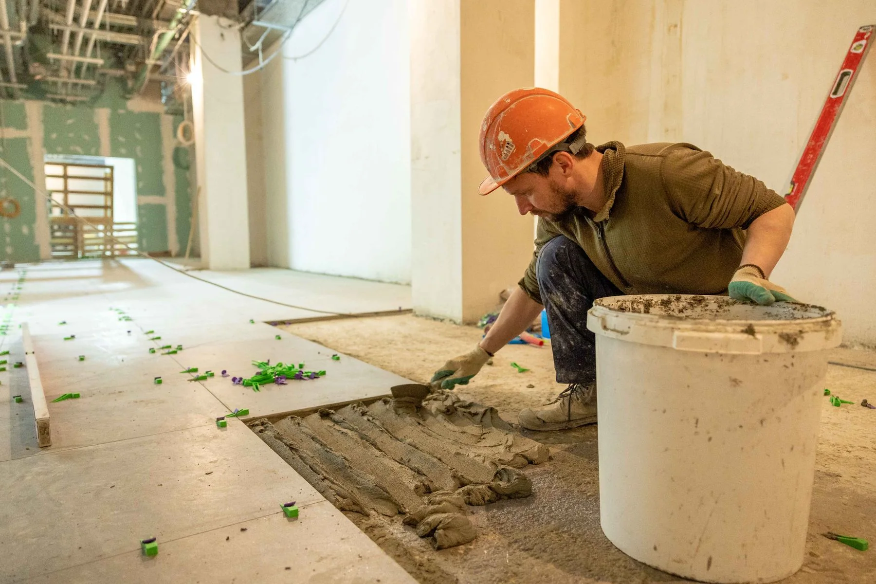 Tile installer working in a home